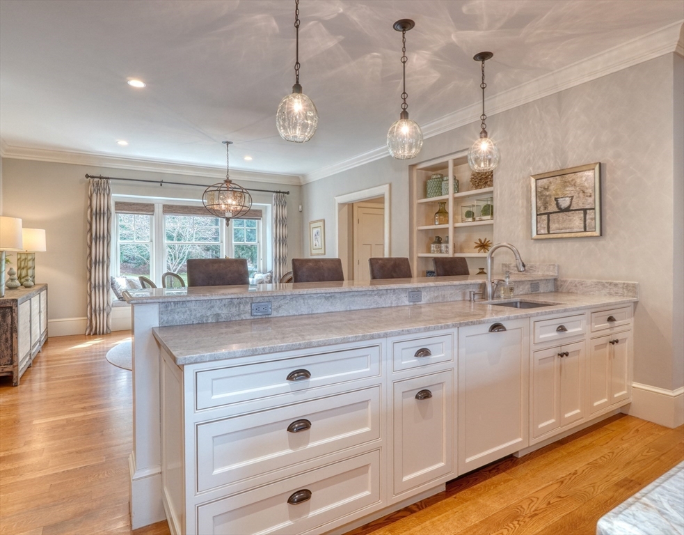 119 Lincoln Road Wayland, MA 01778 - Photo 11 of 40 a open kitchen with granite countertop a stove and white cabinets