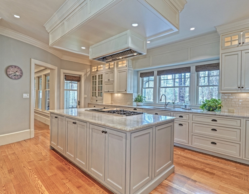 119 Lincoln Road Wayland, MA 01778 - Photo 12 of 40 a kitchen with stainless steel appliances granite countertop a stove and a sink