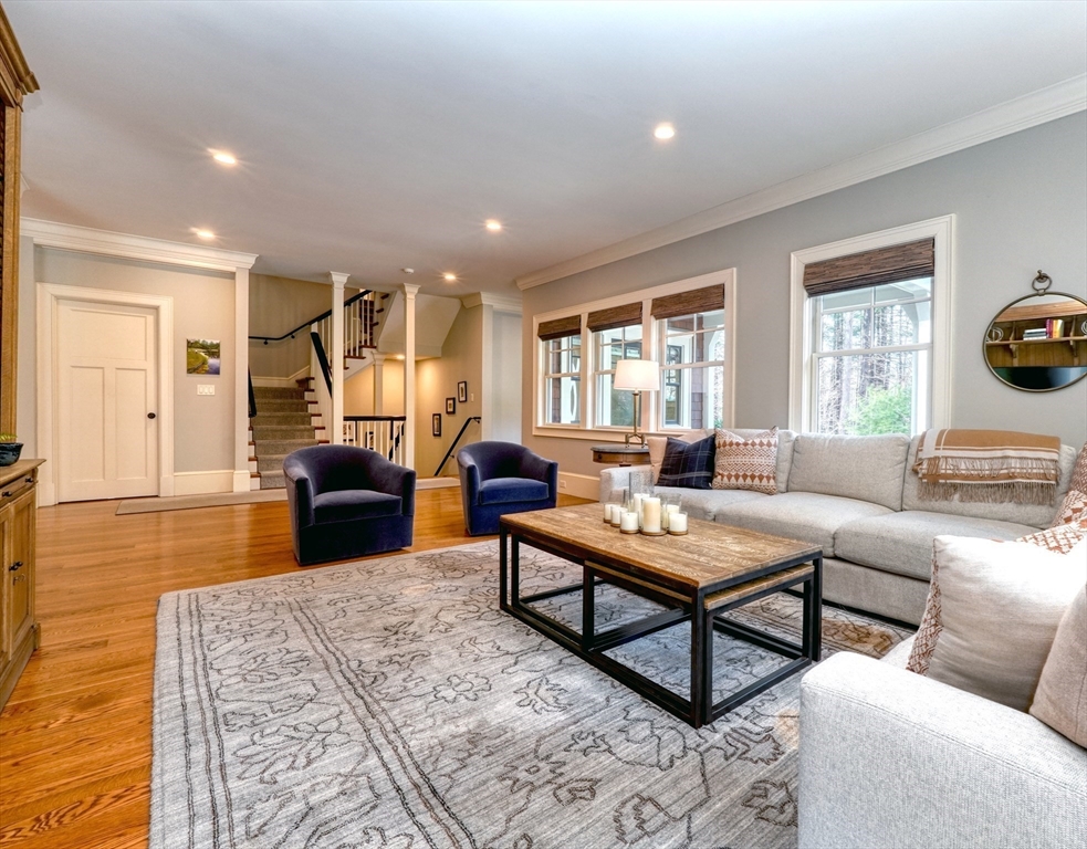 119 Lincoln Road Wayland, MA 01778 - Photo 15 of 40 a living room with furniture a rug and a table