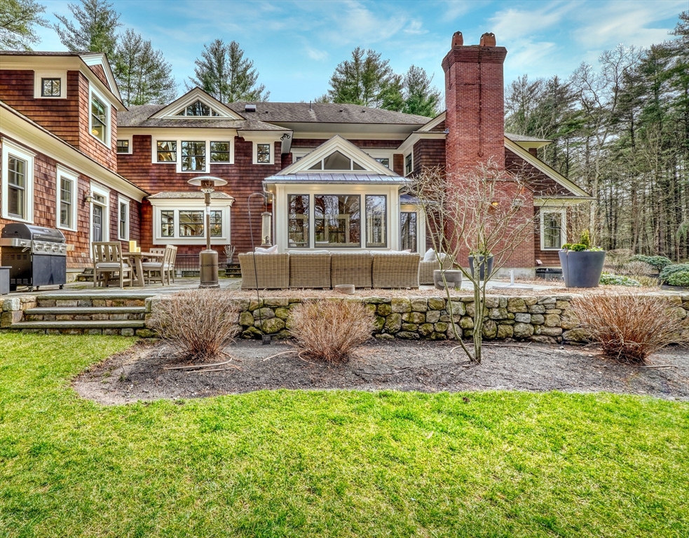 119 Lincoln Road Wayland, MA 01778 - Photo 2 of 40 a front view of a house with a yard