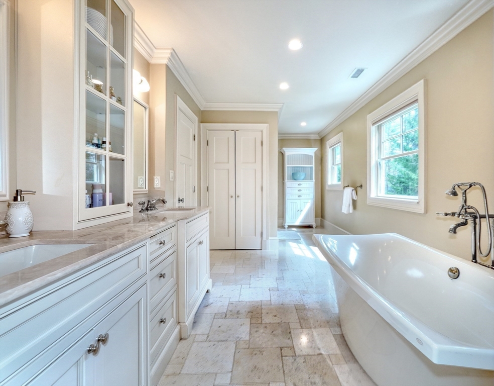 119 Lincoln Road Wayland, MA 01778 - Photo 22 of 40 a spacious bathroom with a granite countertop tub sink and mirror