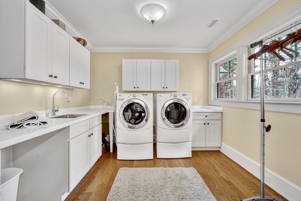 119 Lincoln Road Wayland, MA 01778 - Photo 24 of 40 a utility room with sink dryer and washer