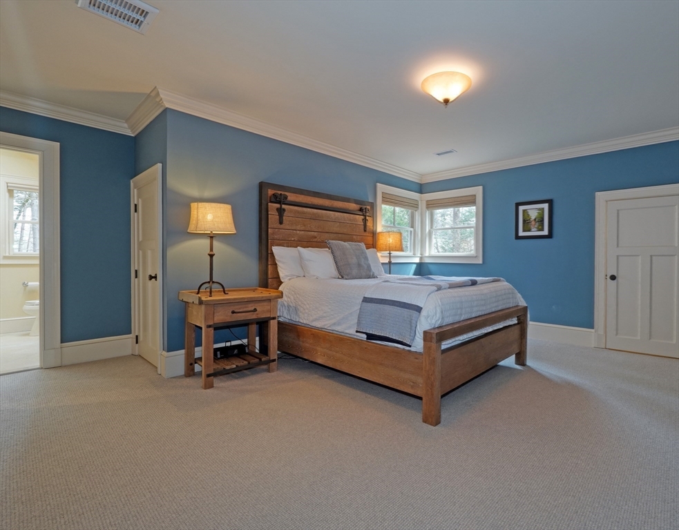 119 Lincoln Road Wayland, MA 01778 - Photo 25 of 40 a bedroom with a bed and a cabinets
