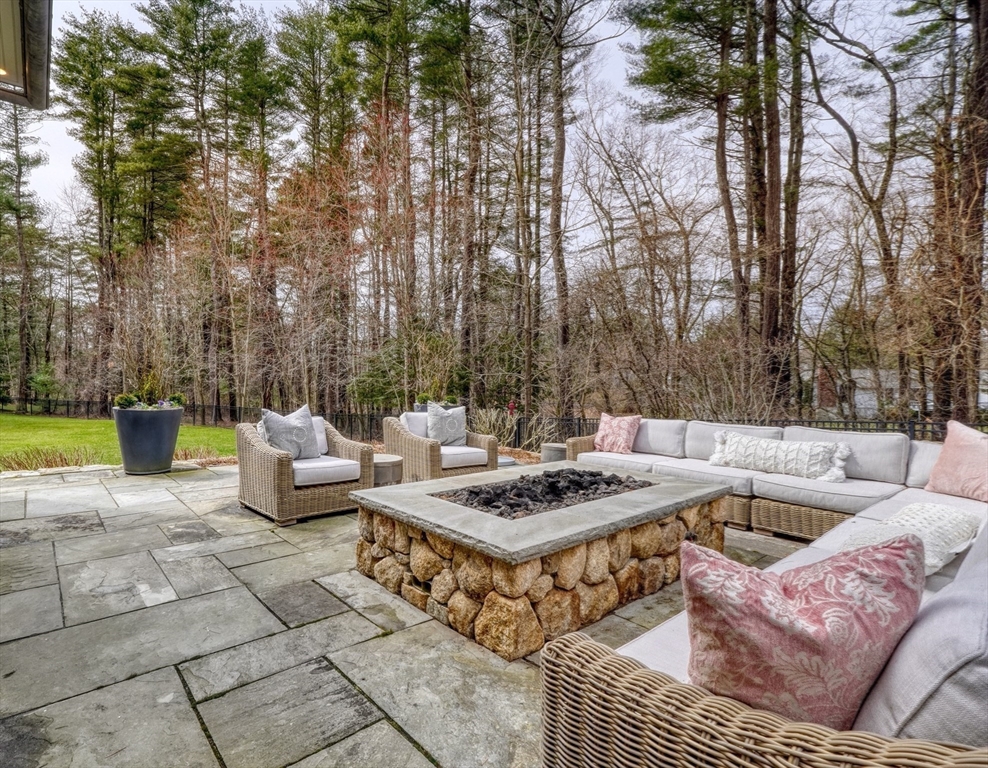 119 Lincoln Road Wayland, MA 01778 - Photo 30 of 40 a view of a swimming pool with couches and chairs