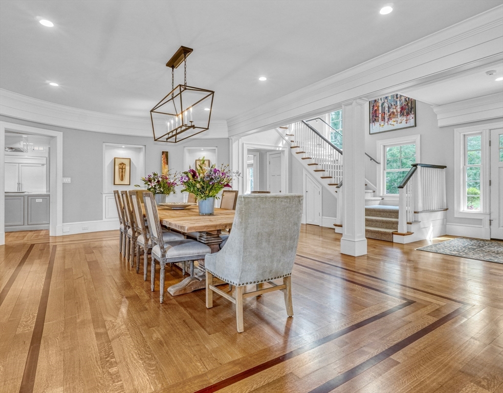 119 Lincoln Road Wayland, MA 01778 - Photo 3 of 40 a view of a dining room with furniture wooden floor and chandelier