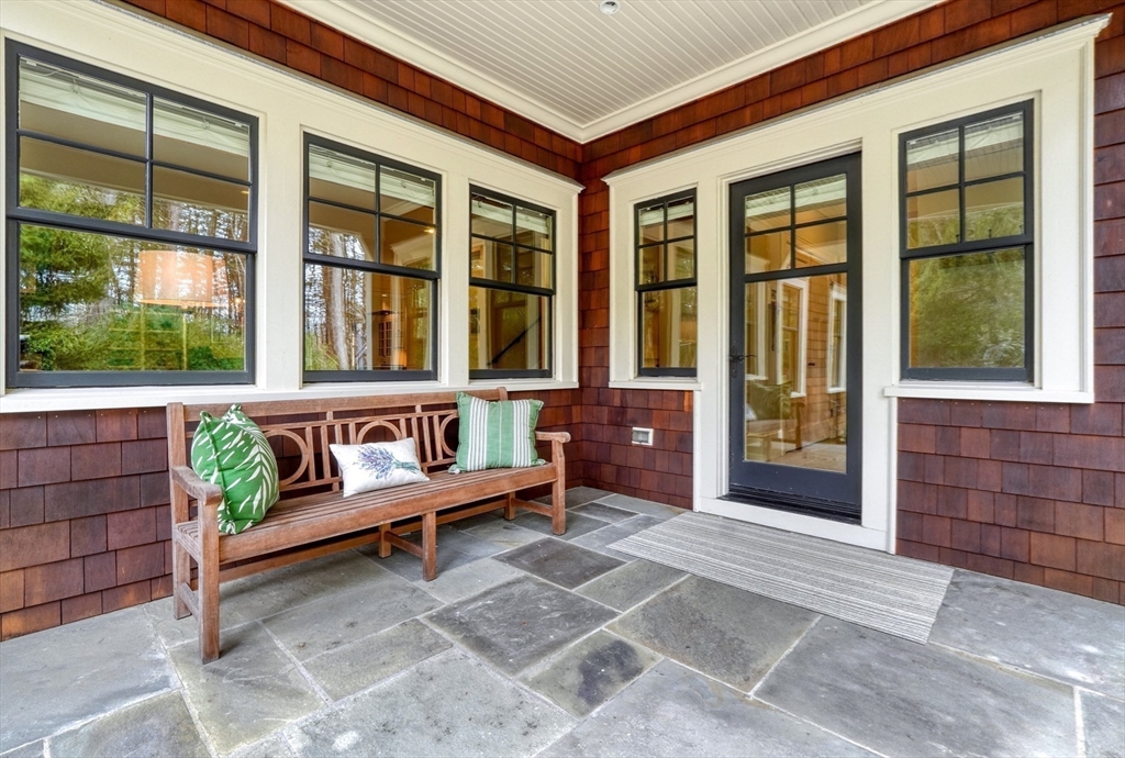 119 Lincoln Road Wayland, MA 01778 - Photo 33 of 40 a view of a bench in front of house