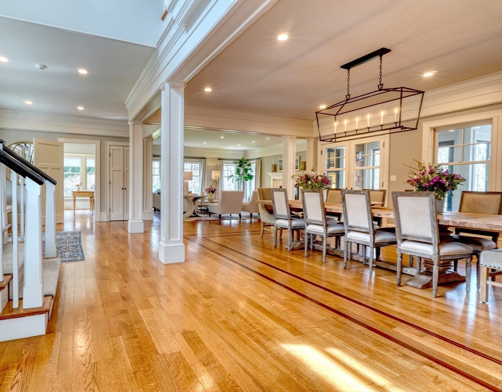 119 Lincoln Road Wayland, MA 01778 - Photo 6 of 40 a living room with lots of furniture and a chandelier