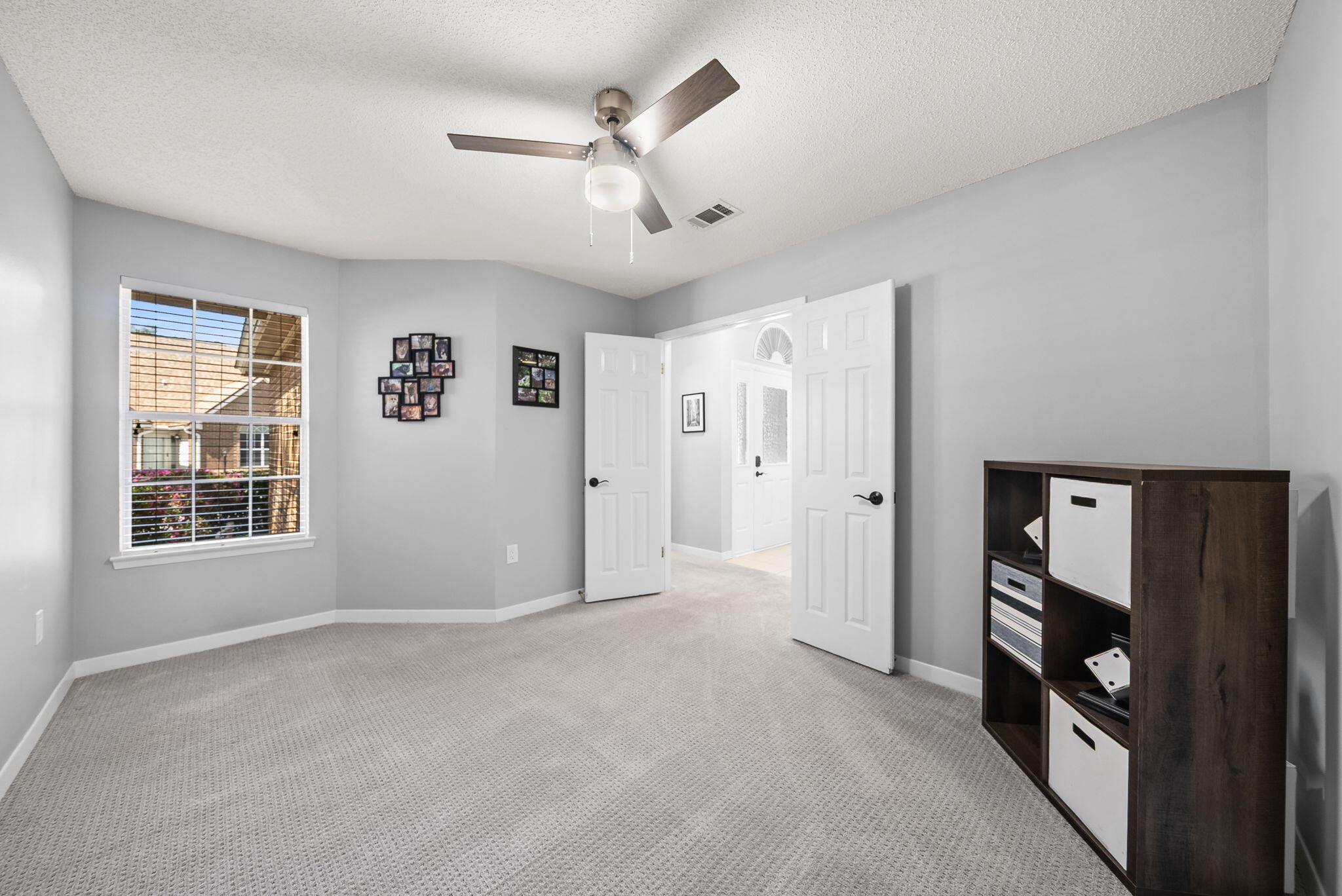714 Putter Drive Niceville, FL 32578 - Photo 15 of 49 an empty room with windows and closet