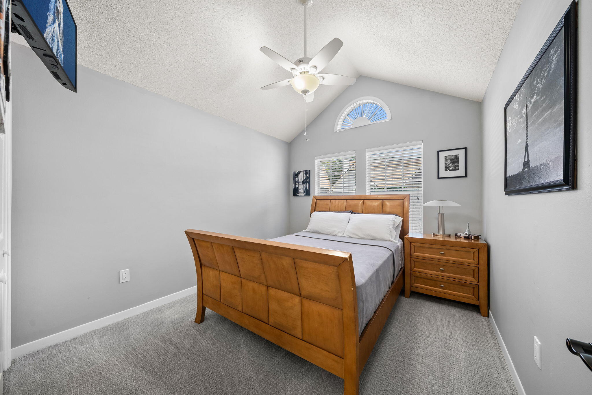 714 Putter Drive Niceville, FL 32578 - Photo 16 of 49 a bedroom with a bed and a chandelier