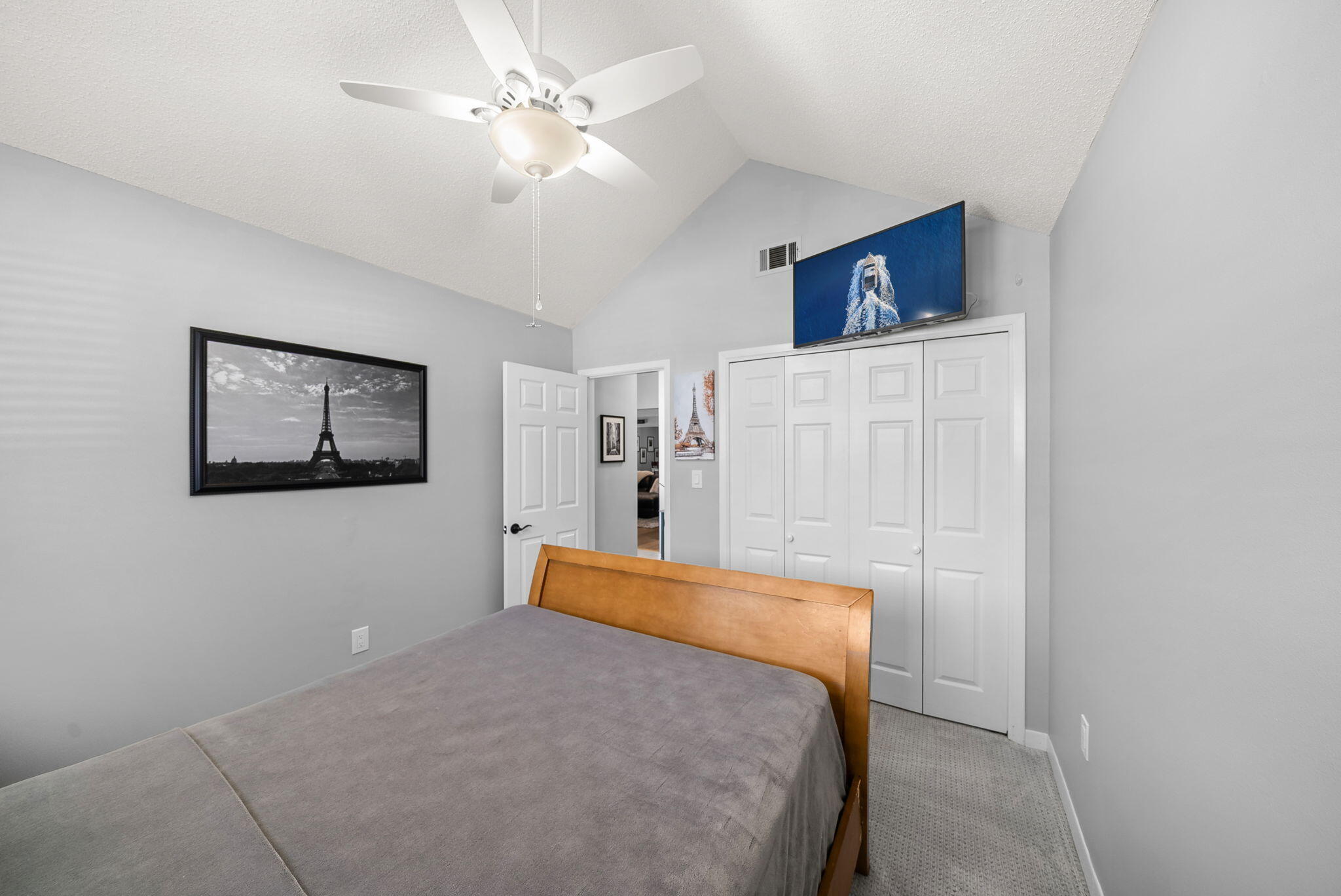 714 Putter Drive Niceville, FL 32578 - Photo 17 of 49 a bedroom with a bed and a chandelier