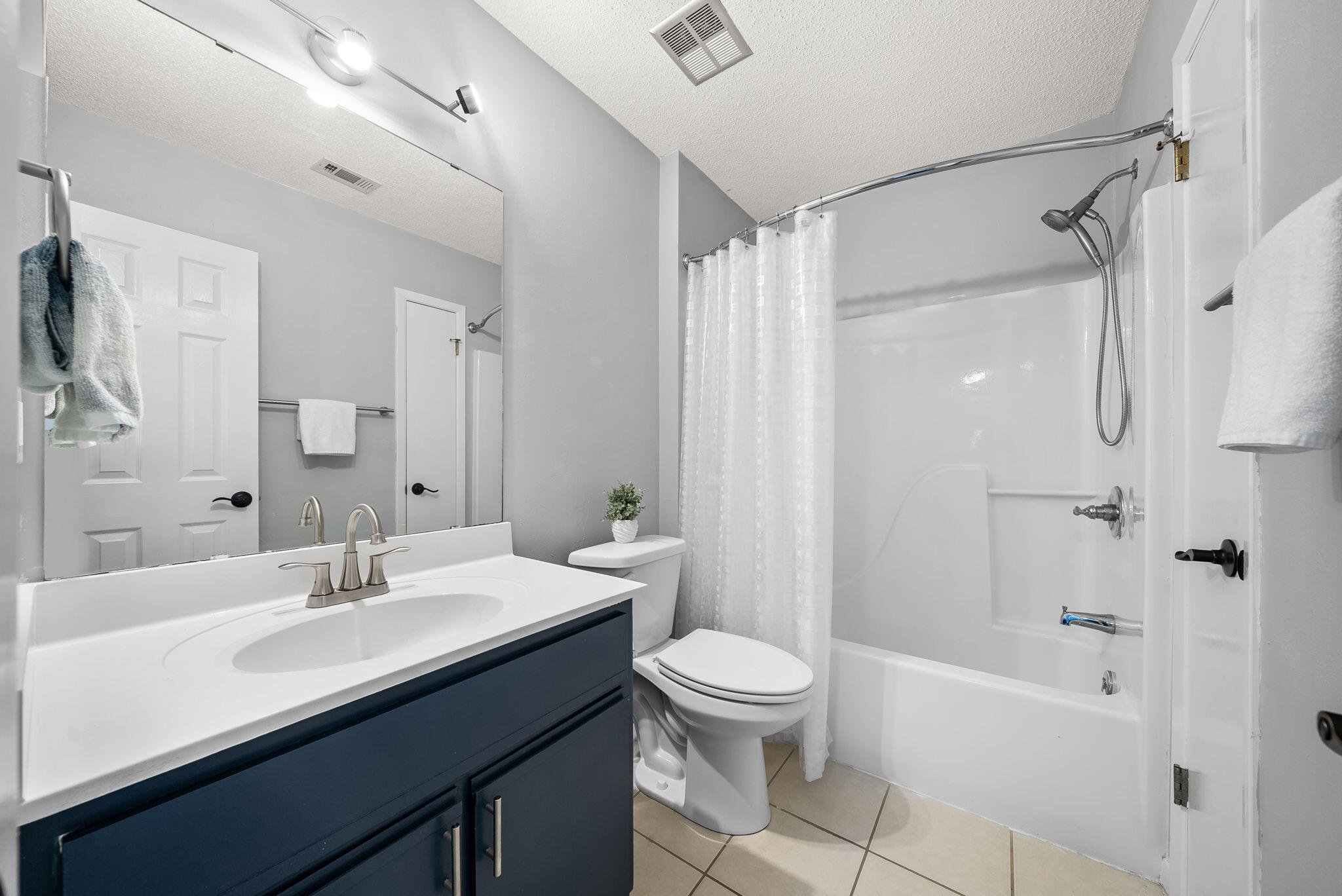 714 Putter Drive Niceville, FL 32578 - Photo 18 of 49 a bathroom with a sink a toilet and shower
