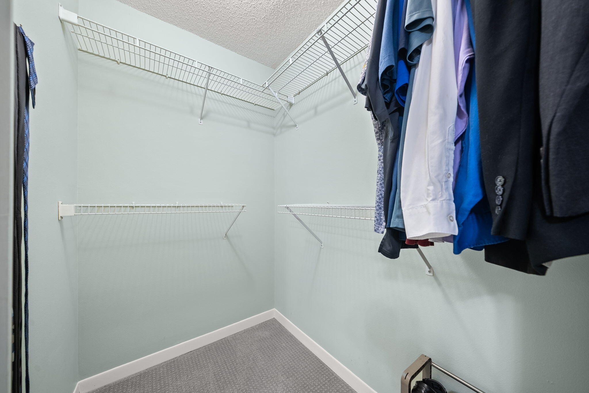 714 Putter Drive Niceville, FL 32578 - Photo 22 of 49 a view of walk in closet with clothes