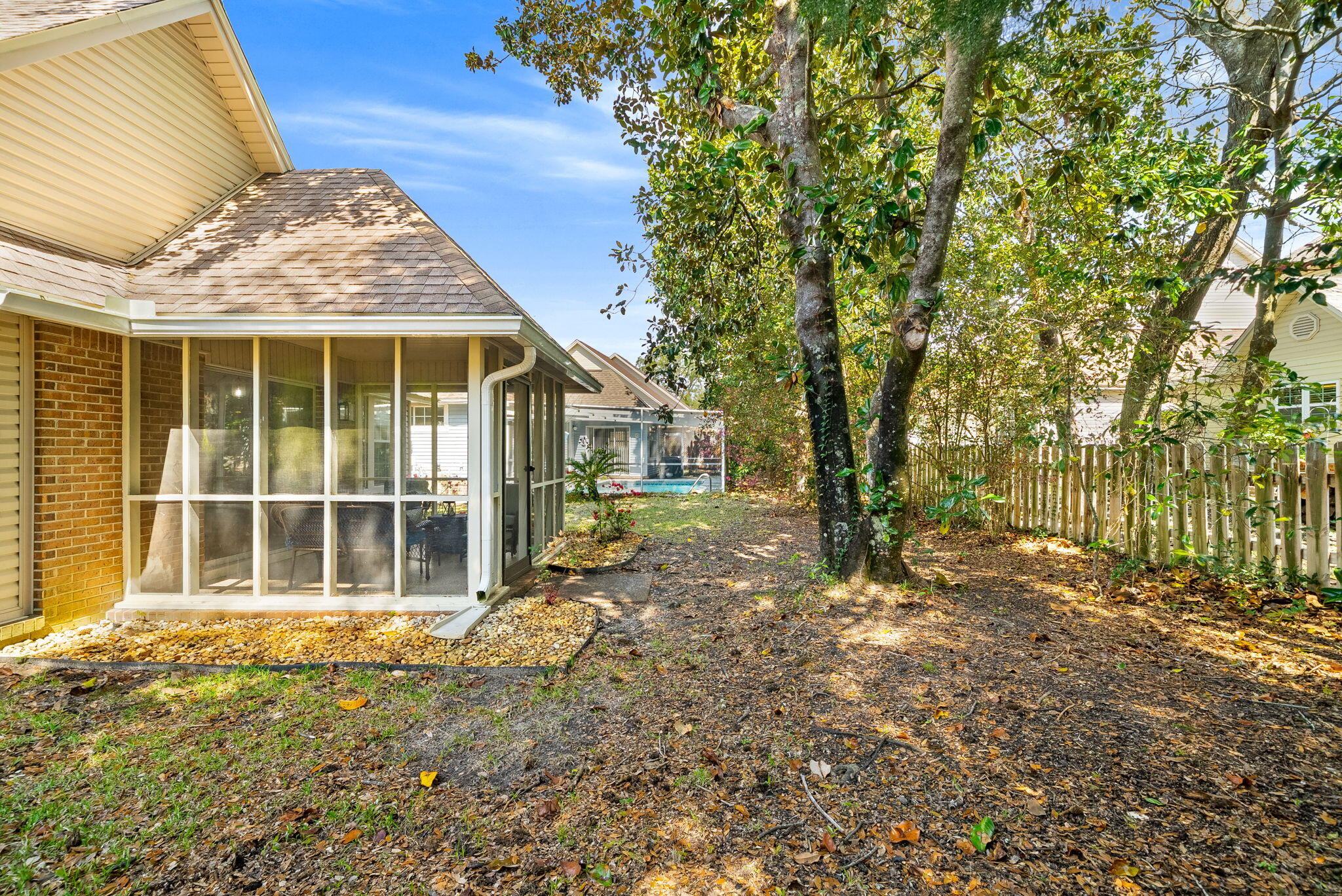 714 Putter Drive Niceville, FL 32578 - Photo 29 of 49 a view of a house with a large window and wooden fence