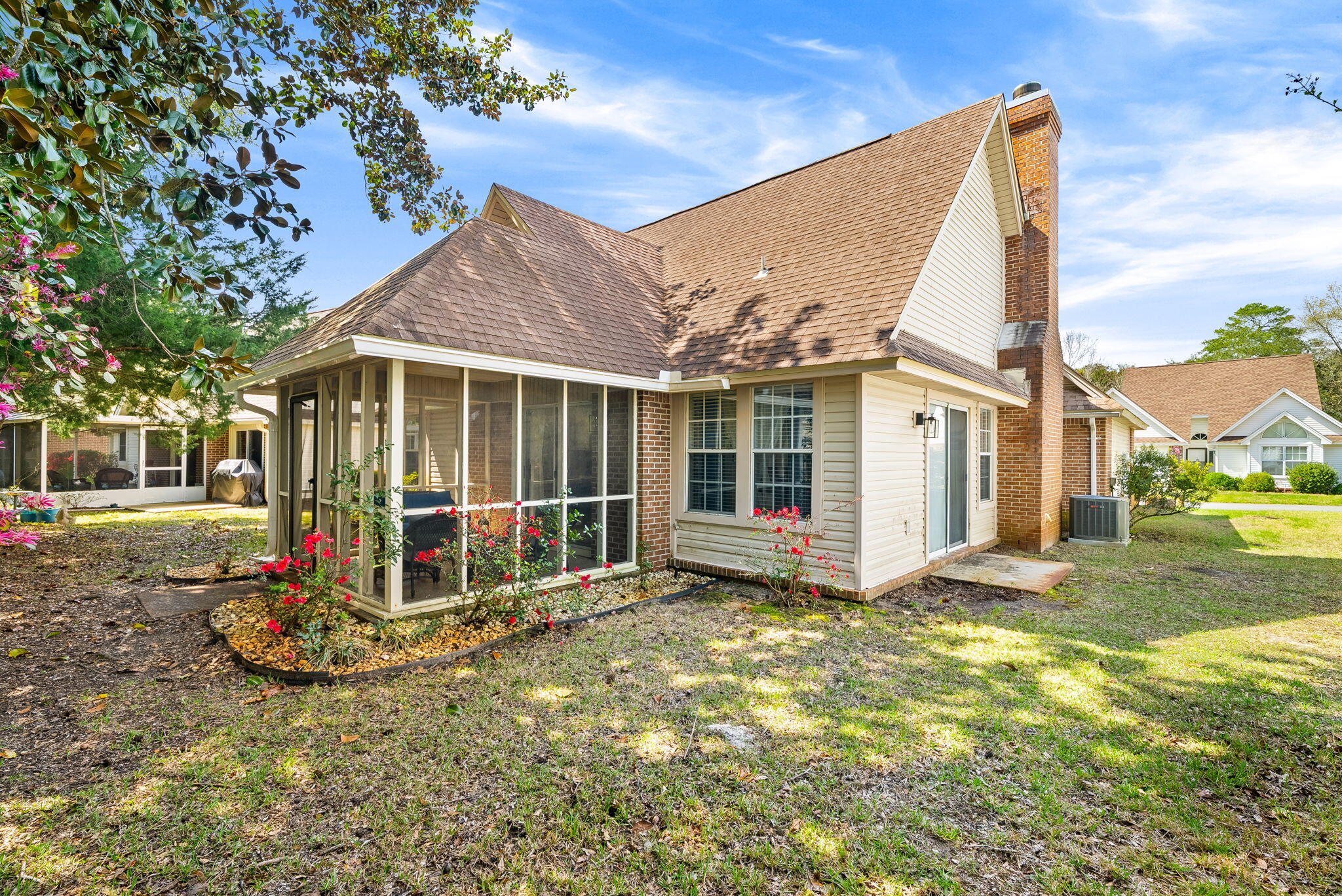 714 Putter Drive Niceville, FL 32578 - Photo 30 of 49 a view of a house with a yard and sitting area