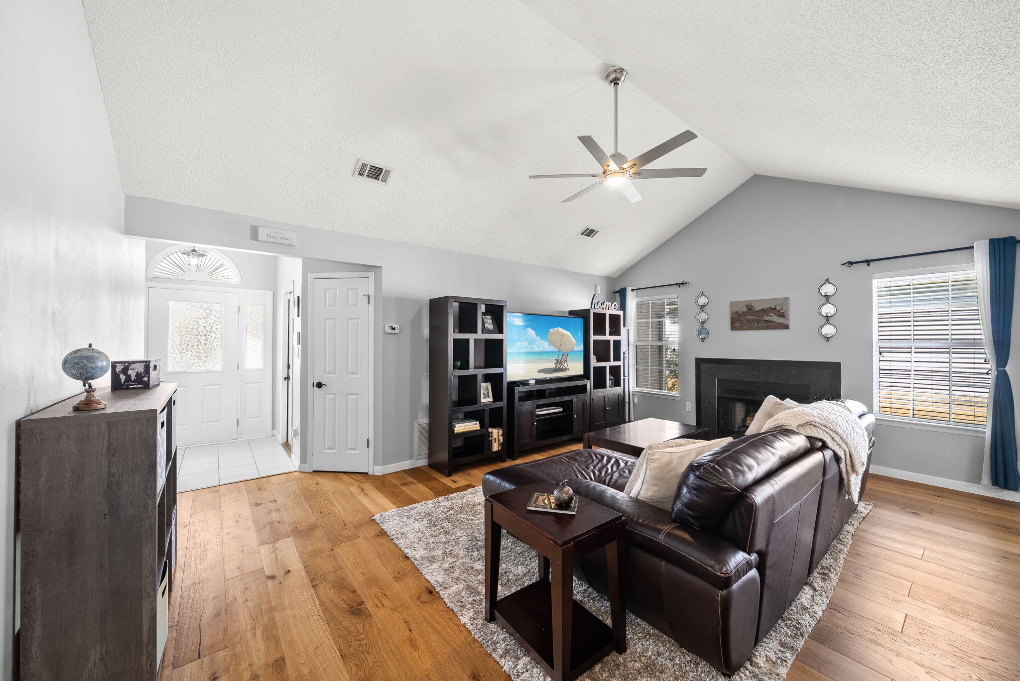 714 Putter Drive Niceville, FL 32578 - Photo 4 of 49 a living room with fireplace furniture and a flat screen tv