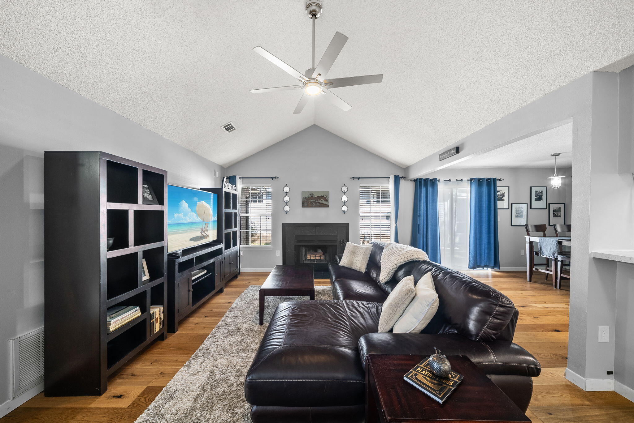 714 Putter Drive Niceville, FL 32578 - Photo 5 of 49 a living room with furniture a fireplace and a chandelier