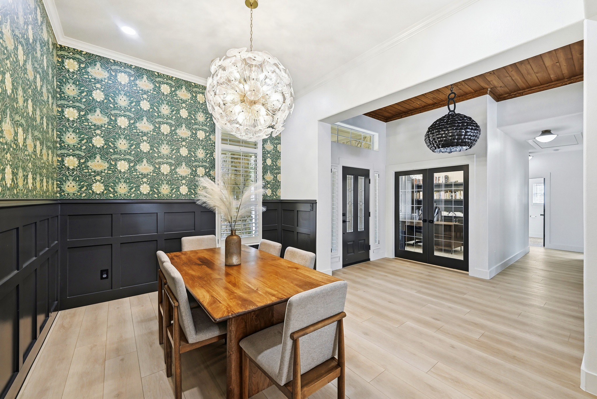 131 Eaton Lane Austin, TX 78737 - Photo 11 of 40 a view of a dining room with furniture and chandelier