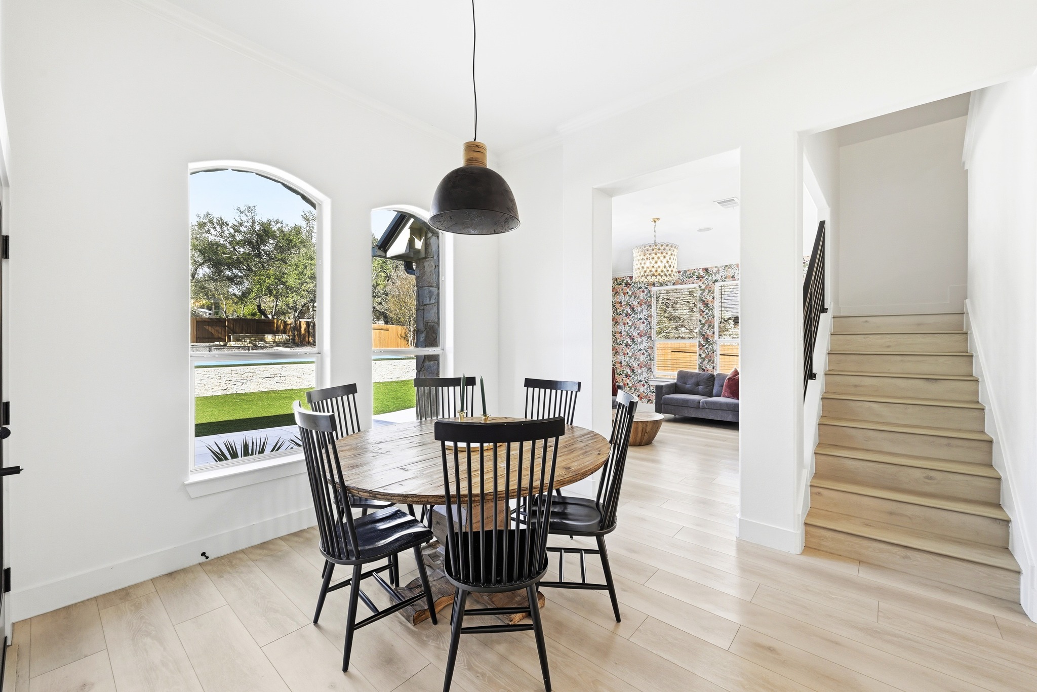 131 Eaton Lane Austin, TX 78737 - Photo 13 of 40 a view of a dining room with furniture window and wooden floor