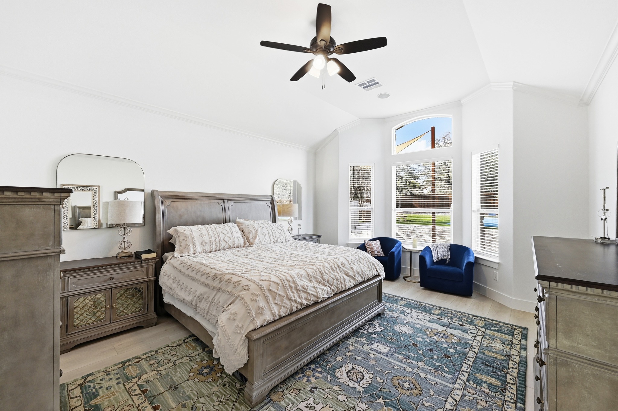 131 Eaton Lane Austin, TX 78737 - Photo 17 of 40 a bedroom with a large bed and a couch