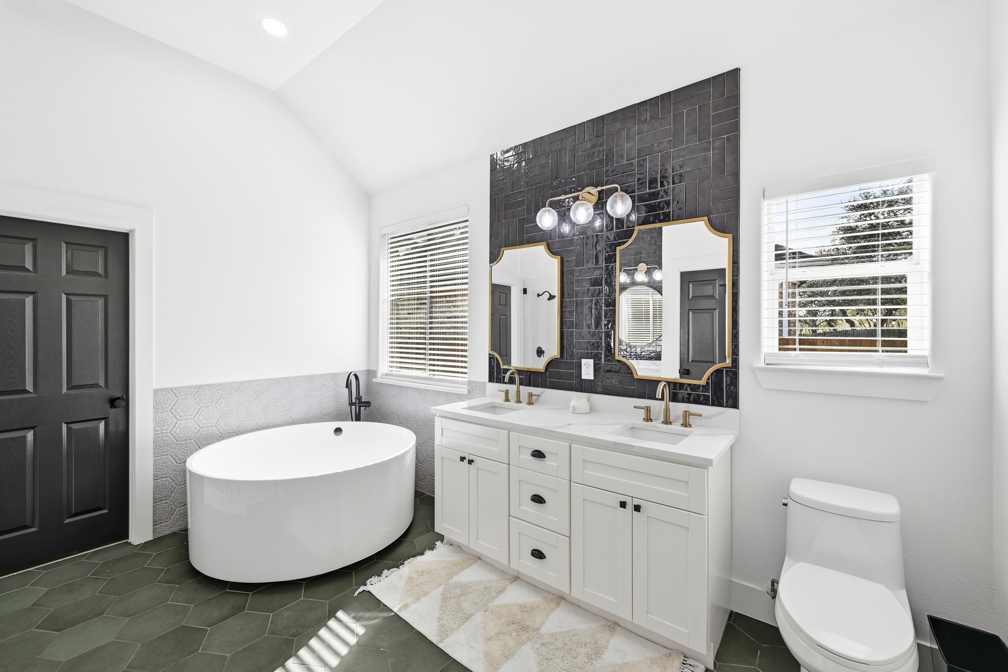 131 Eaton Lane Austin, TX 78737 - Photo 19 of 40 a bathroom with a double vanity sink mirror and bathtub
