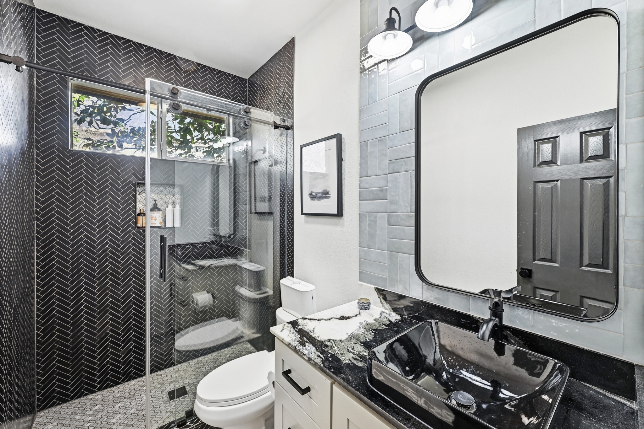 131 Eaton Lane Austin, TX 78737 - Photo 22 of 40 a bathroom with a granite countertop sink mirror vanity and toilet