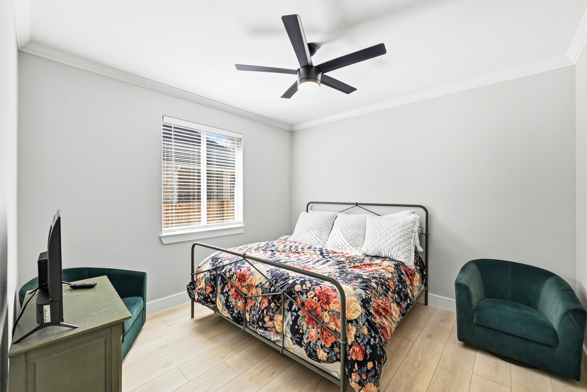 131 Eaton Lane Austin, TX 78737 - Photo 25 of 40 a bedroom with a bed and a couch