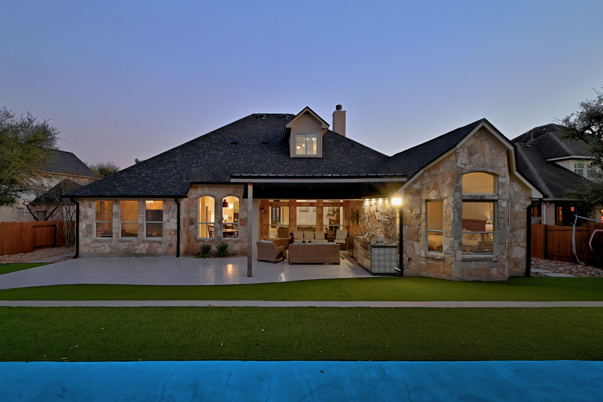 131 Eaton Lane Austin, TX 78737 - Photo 30 of 40 a view of a house with a big yard and potted plants