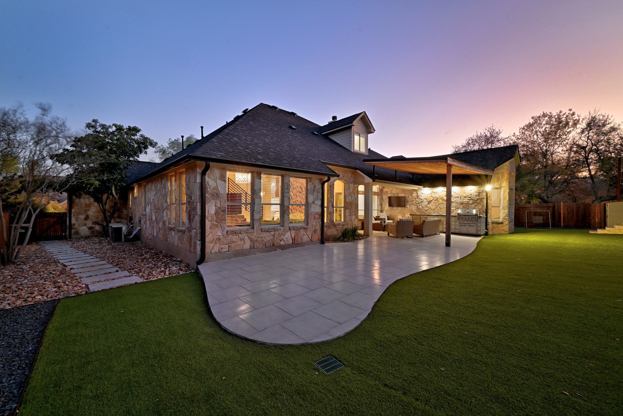131 Eaton Lane Austin, TX 78737 - Photo 35 of 40 a view of a swimming pool with an outdoor space and seating area