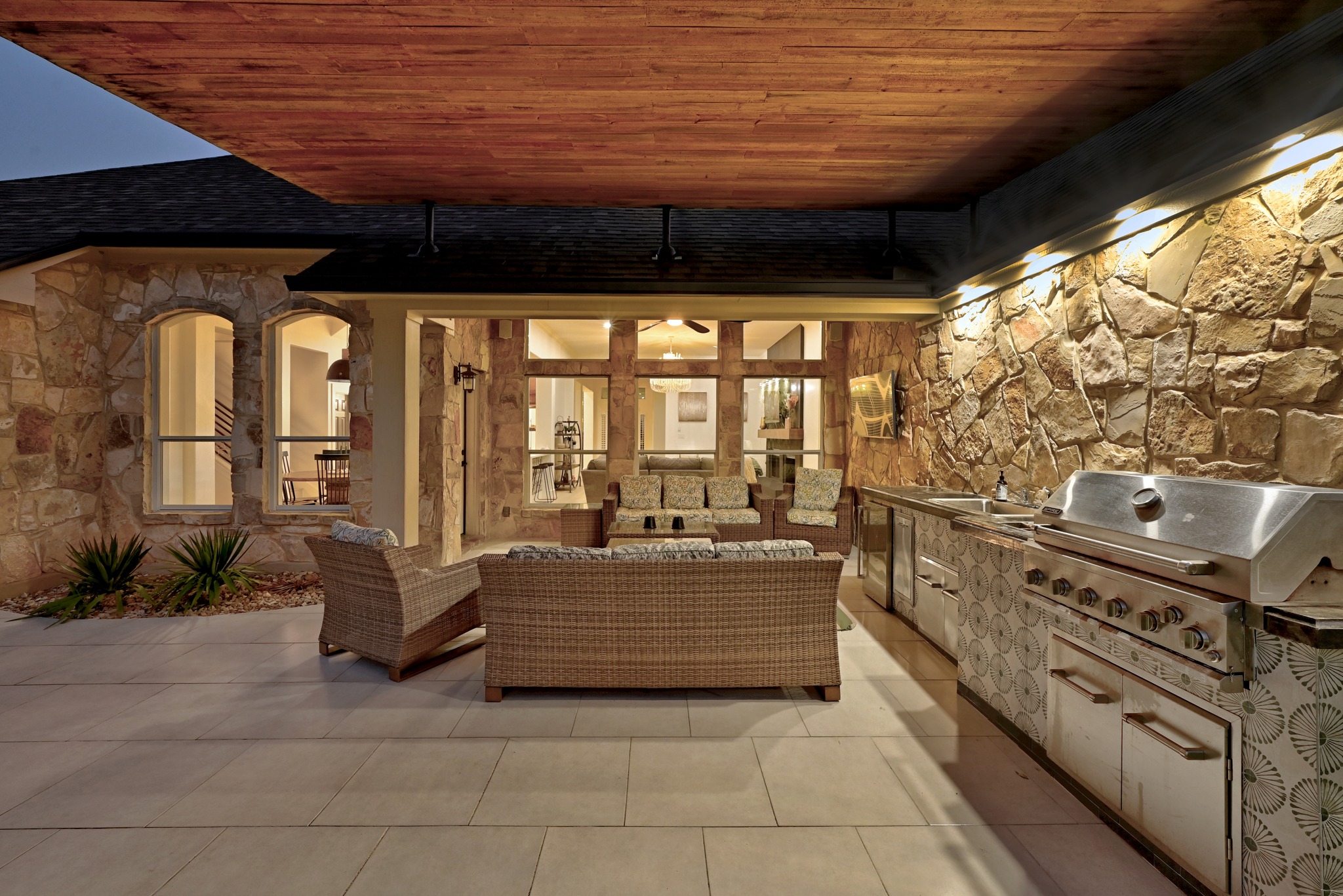 131 Eaton Lane Austin, TX 78737 - Photo 37 of 40 a living room with furniture and a floor to ceiling window