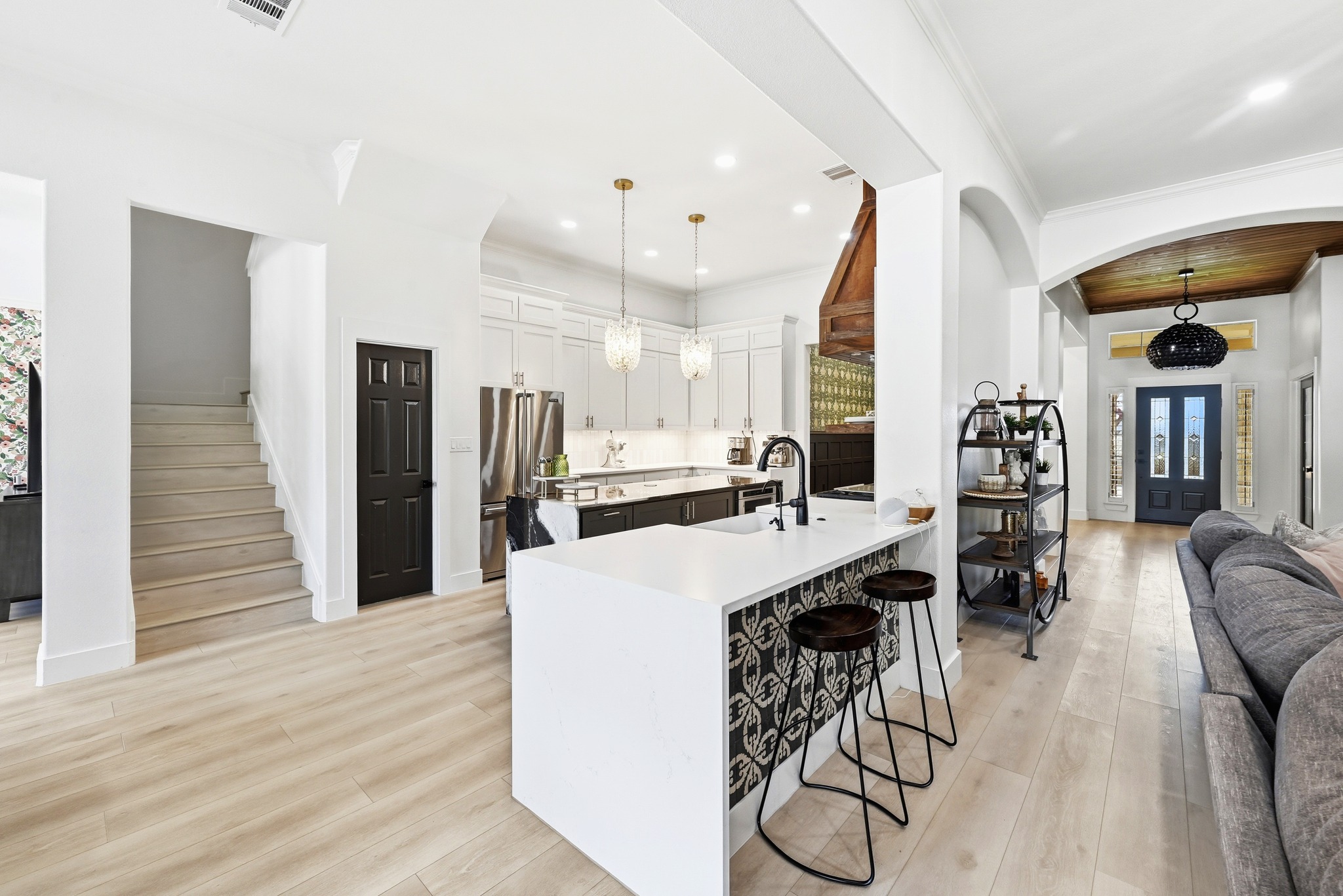 131 Eaton Lane Austin, TX 78737 - Photo 4 of 40 a kitchen with stainless steel appliances kitchen island granite countertop a table chairs and a refrigerator