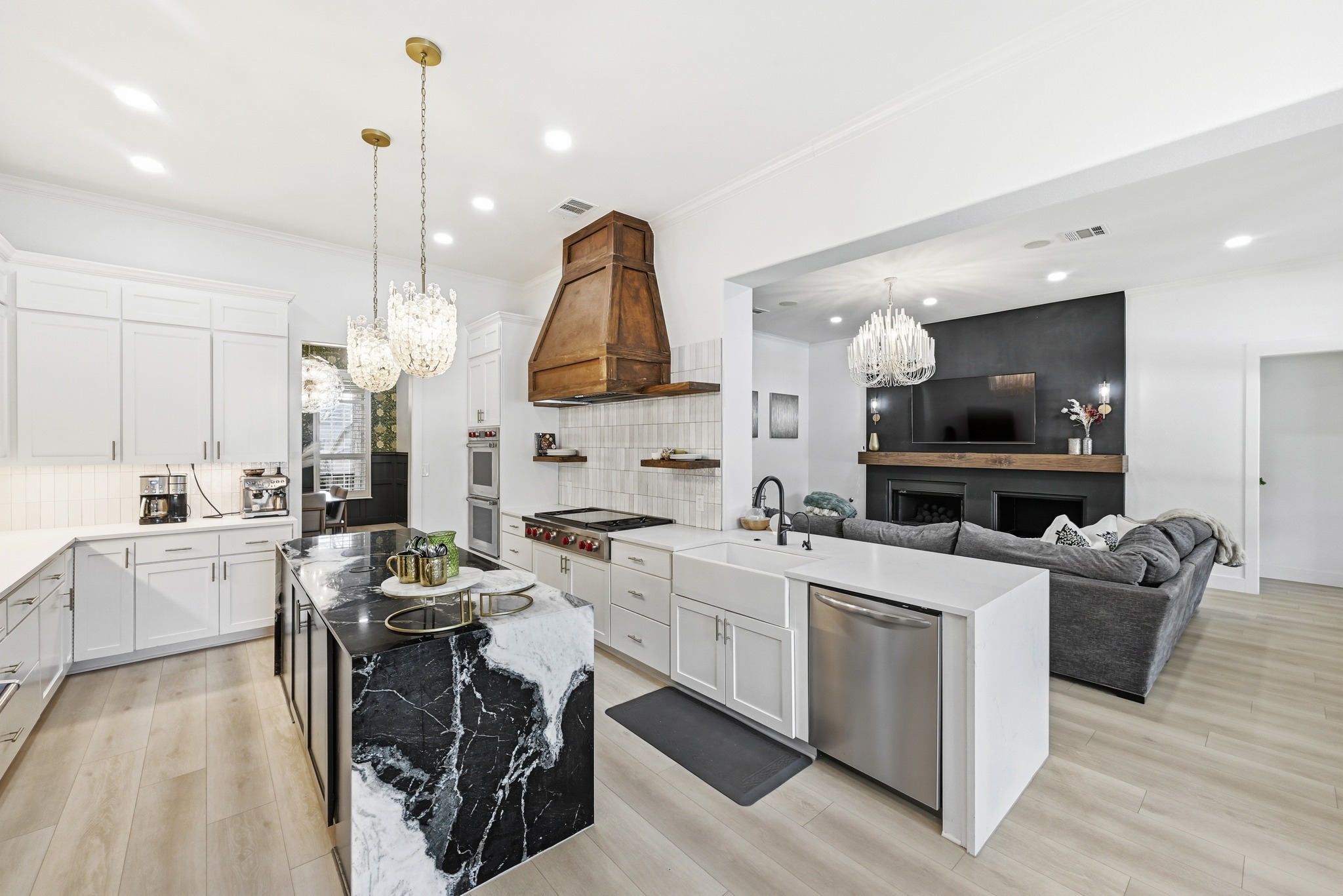 131 Eaton Lane Austin, TX 78737 - Photo 5 of 40 a living room with furniture a flat screen tv and kitchen view
