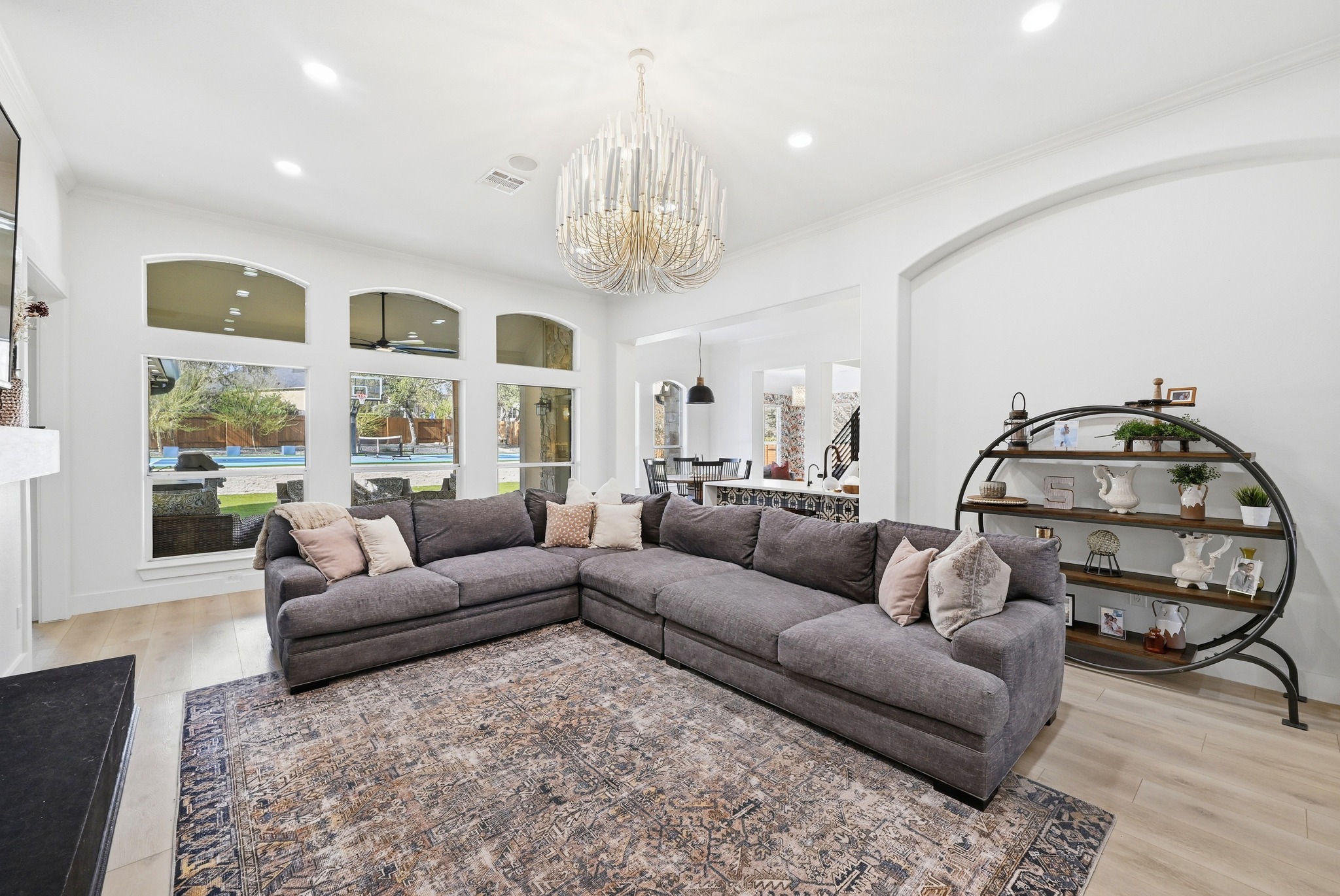 131 Eaton Lane Austin, TX 78737 - Photo 8 of 40 a living room with furniture and a chandelier
