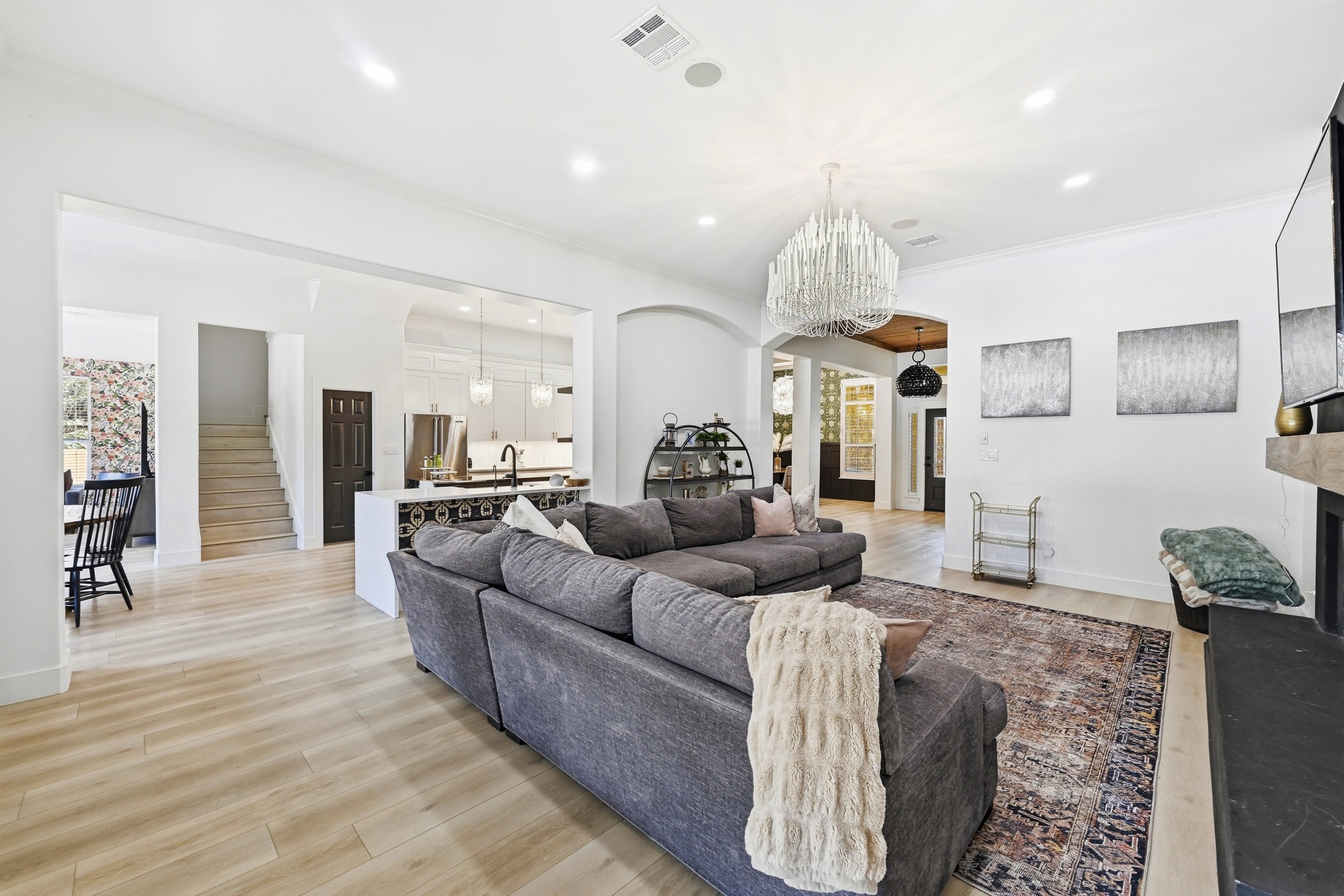131 Eaton Lane Austin, TX 78737 - Photo 9 of 40 a living room with furniture and a chandelier