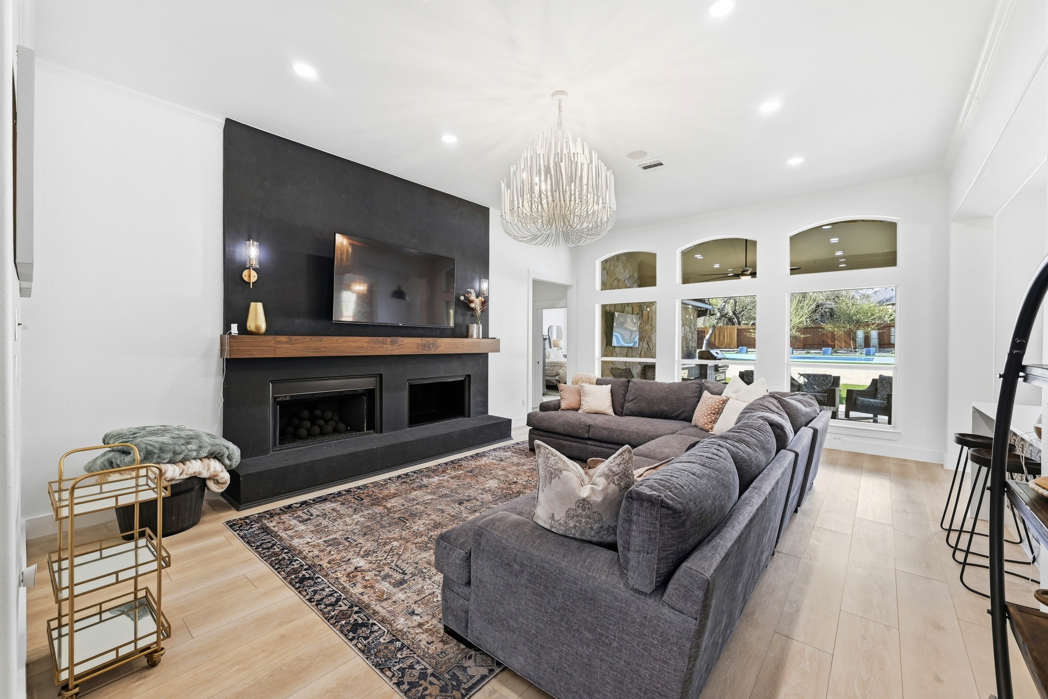 131 Eaton Lane Austin, TX 78737 - Photo 10 of 40 a living room with furniture and a fireplace