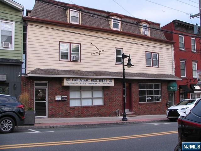 405 Hackensack Street, Unit 6 Carlstadt, NJ 07072 - Photo 3 of 3 a building that has a lots of windows