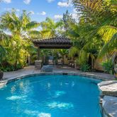 a view of a swimming pool with a patio