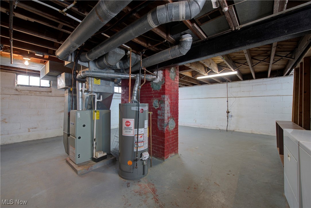 4041 Wilmington Road Cleveland, OH 44121 - Photo 32 of 38 Below grade area featuring water heater and heating unit
