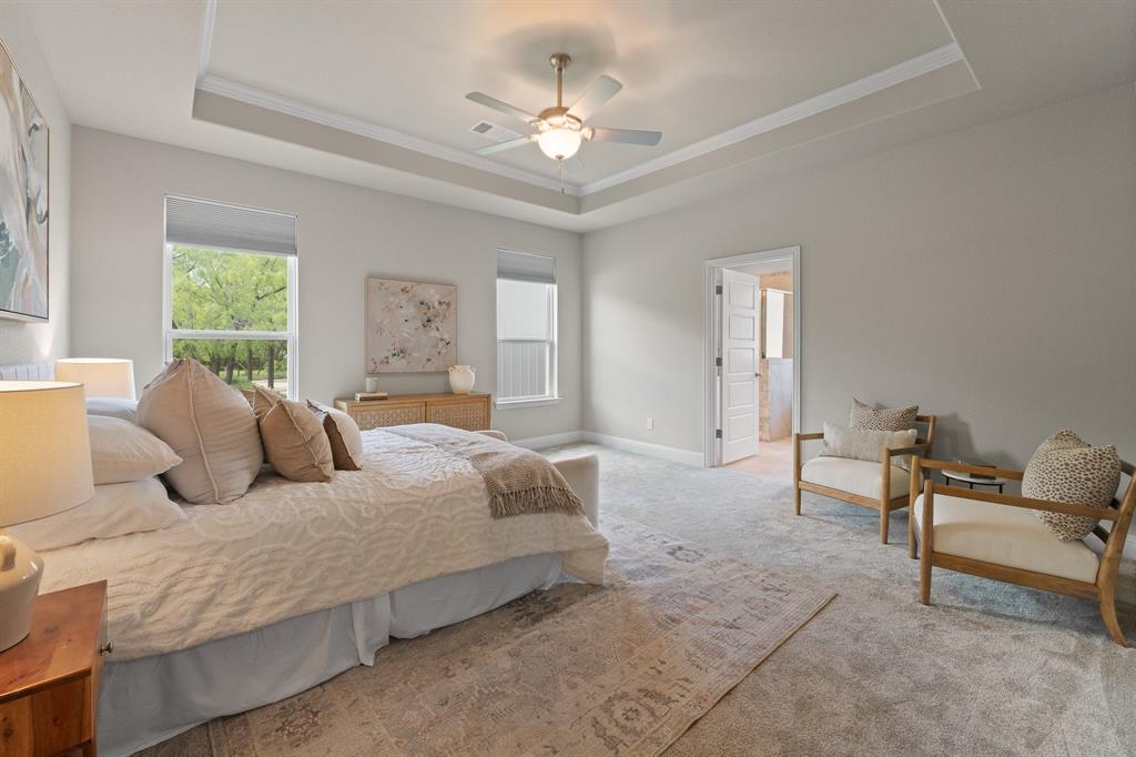 1001 Resolute Road Millsap, TX 76066 - Photo 16 of 40 a bedroom with a bed a couch and a chandelier