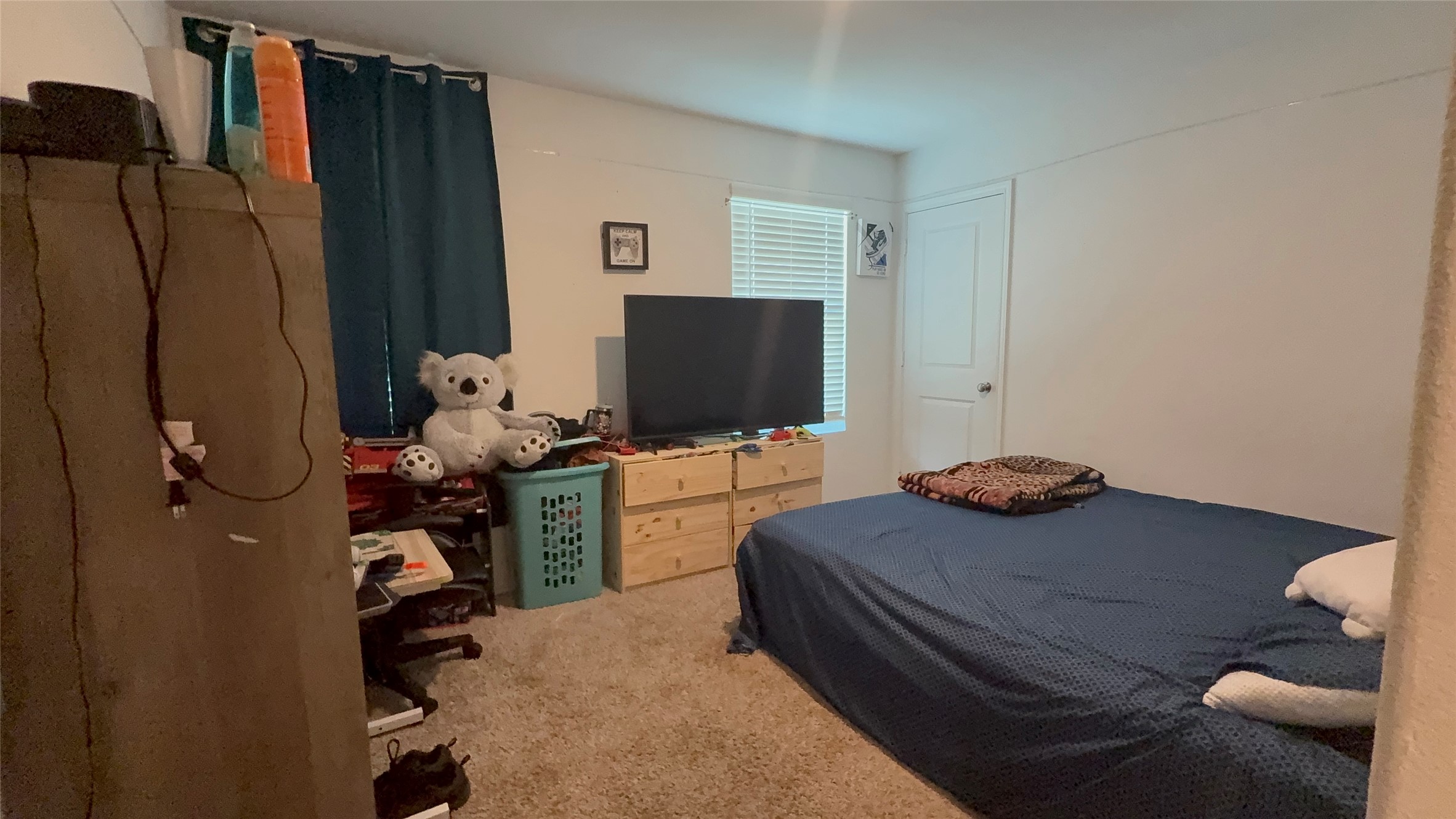 316 Geode Glen Maxwell, TX 78656 - Photo 24 of 24 a bedroom with a bed and a flat screen tv