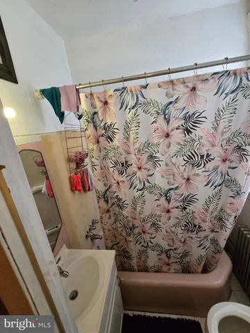 a bathroom with a bathtub and shower