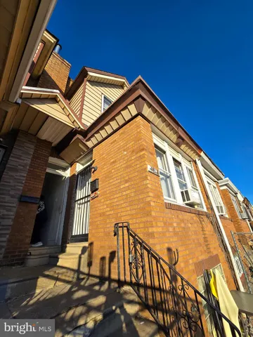 a backyard of a house with wooden floor and city view