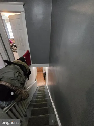 a view of walk in closet with clothes