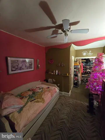 a bedroom with a bed and a mirror