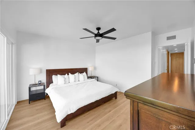 a bed room with a bed and a chandelier