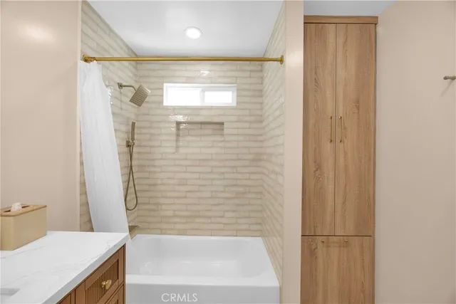 a bathroom with a shower and a toilet