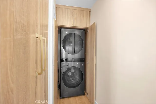 a view of storage and utility room with washer and dryer