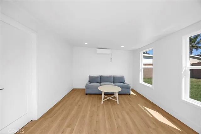 a room with a chair and wooden floor