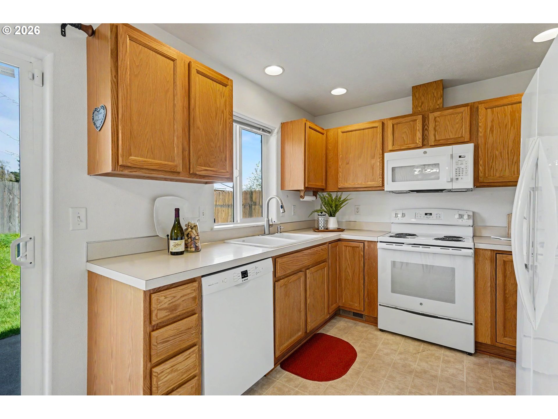 550 Southeast Hankel Street Dallas, OR 97338 - Photo 13 of 36 a kitchen with stainless steel appliances granite countertop a sink and a stove