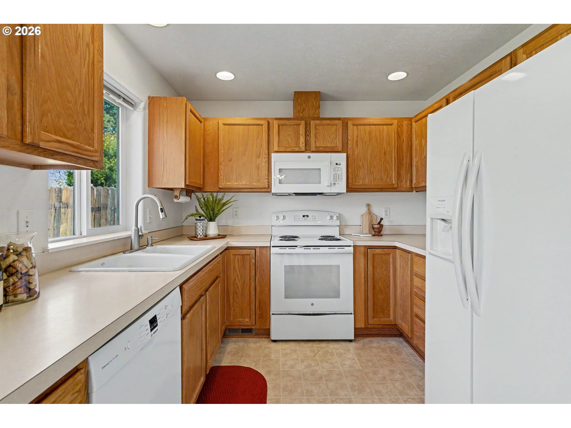 550 Southeast Hankel Street Dallas, OR 97338 - Photo 14 of 36 a kitchen with a sink stove and cabinets