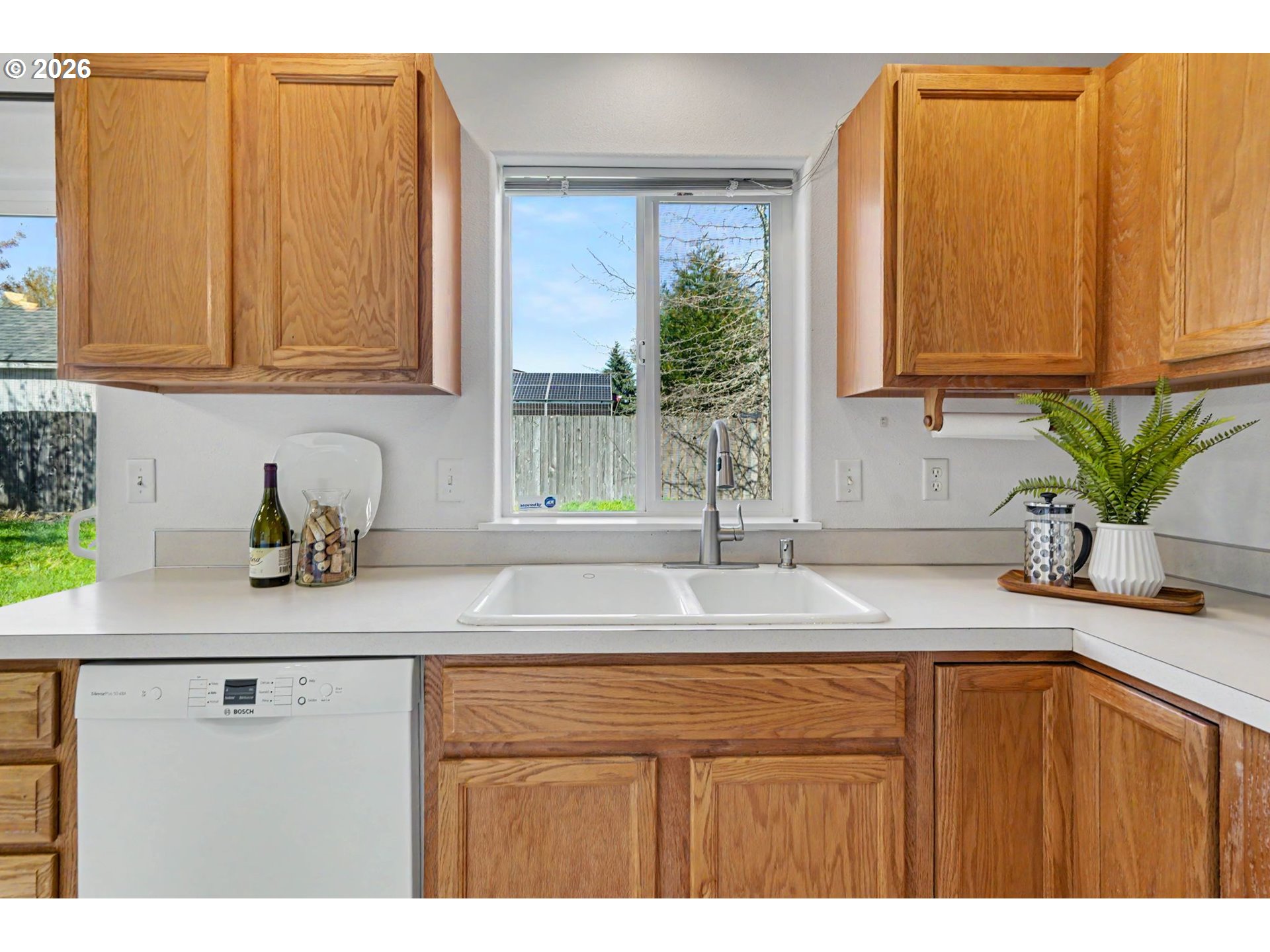 550 Southeast Hankel Street Dallas, OR 97338 - Photo 15 of 36 a kitchen with stainless steel appliances granite countertop a sink a counter space and cabinets